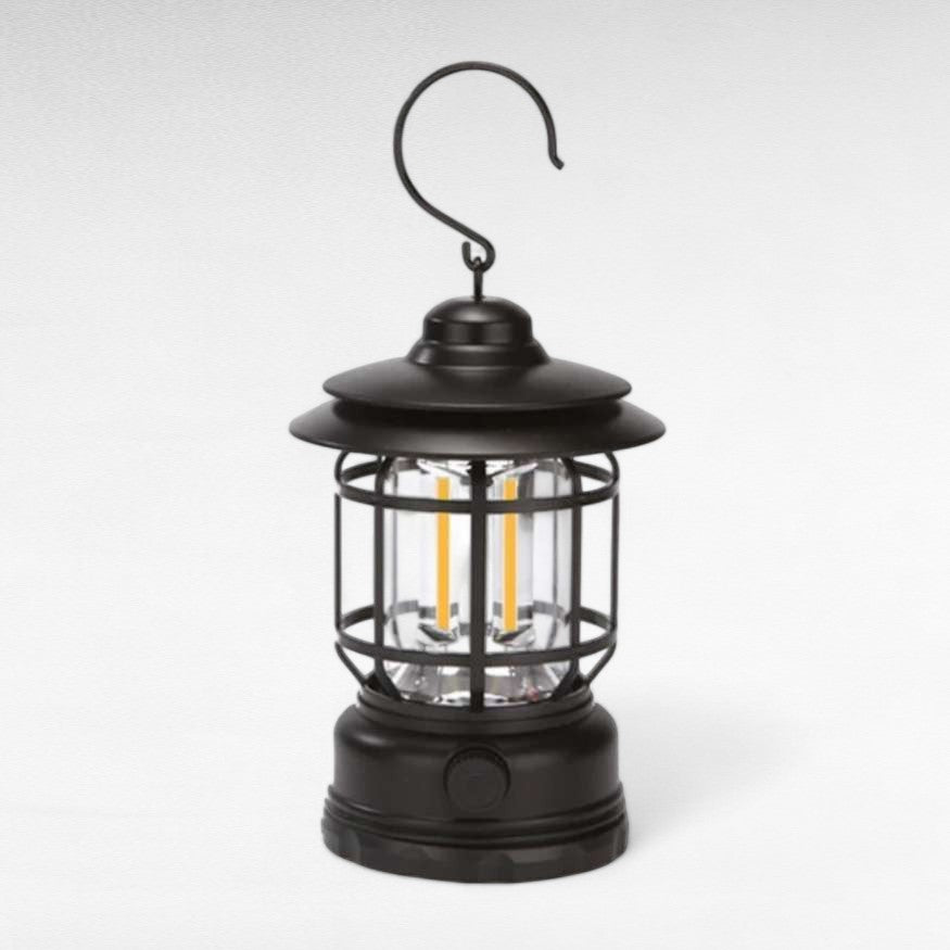 Draagbare lantaarn met handvat en metalen frame