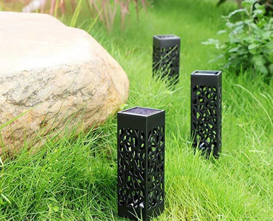 Dekoracyjna solarna latarnia ogrodowa tworzaca nastrojowe cienie