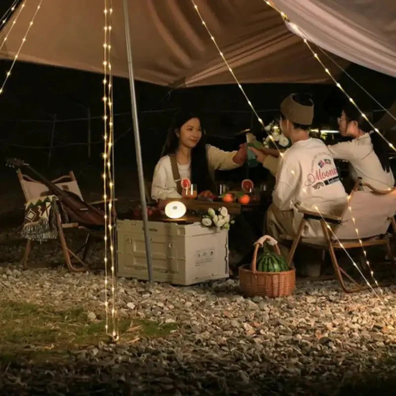 Ronde draagbare lamp met uitschuifbare lichtketting